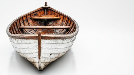 Obraz premium Wooden rowboat with weathered appearance on a minimalist background, showcasing natural textures and colors