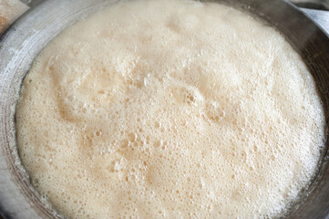 Boiling coconut sap to produce coconut sugar