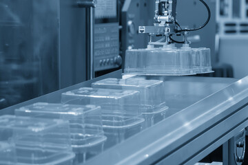 The food container production process by automatic system from plastic injection mold machine.