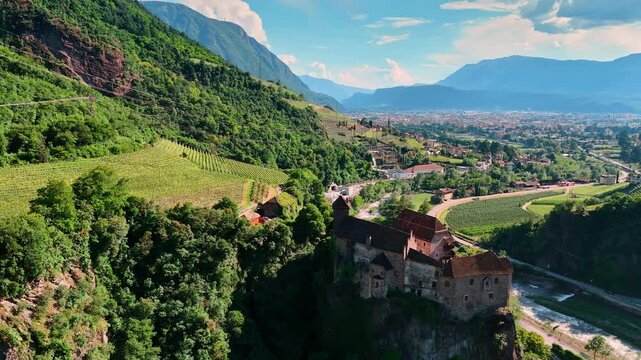 View on a splendid ancient Runkelstein Castle located on the cliff rock. Aerial perspective on the famous landmark and scenery of Bolzano in South Tyrol, Italy.