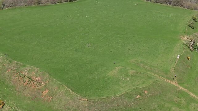 An aerial view rotating close to the remains of the Iron Age Hillfort in rural Leicestershire, UK in springtime