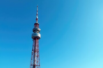 Obraz premium Tall broadcast tower against a clear blue sky, antennas reaching high , outdoor, mast, daytime