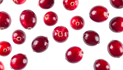 Multiple cranberry halves gently drifting on transparent background