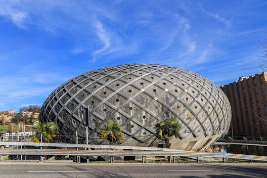 Chiasso, Switzerland - March 15. 2023: The deserted Centro Ovale shopping mall, also called Silver Egg, a landmark. It was opened in 2011 and it becomes a Dead Mall since Dezember 2015.