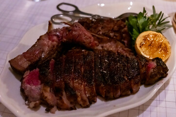 Medium rare meat steak on wooden plate