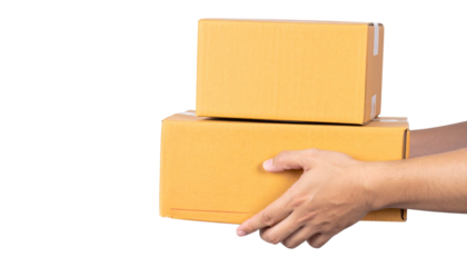 Two cardboard boxes being held by a person's hands.