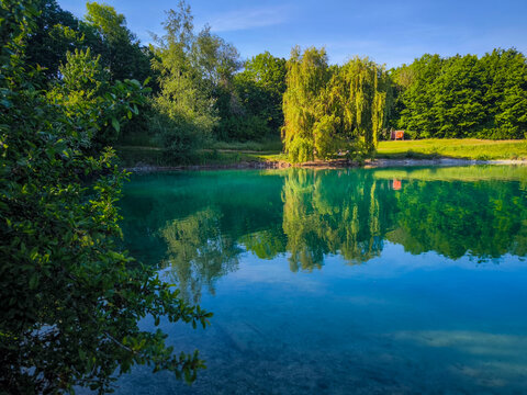 F&uuml;rstenfeldbruck & Olching Emmeringer Lake: A Serene Bavarian Lake with turquoise Water, and Lush Greenery Near Munich