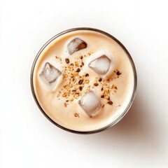 Overhead shot of iced coffee drink with ice cubes and sprinkles in a glass on white background studio shot