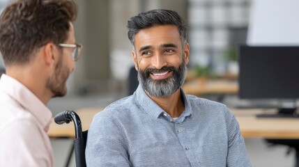 Fototapeta premium Man in Wheelchair Conversing with Colleague in Office Setting