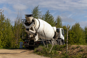 Mixer truck. Concrete pumping on building site
