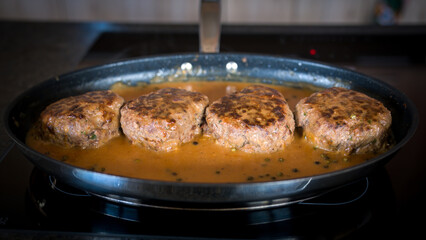 meat balls with pepper sauce roasted in a pan