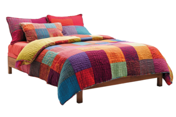 Colorful bed with patchwork quilt and matching pillows creating cozy atmosphere