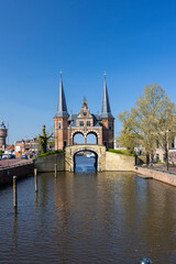 Fototapeta premium Waterpoort of Sneek reflecting on the canal in Friesland, Netherlands