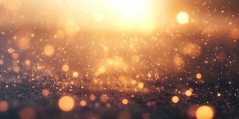 Obraz premium Abstract background with a golden bokeh effect, resembling a starry night or magical particles