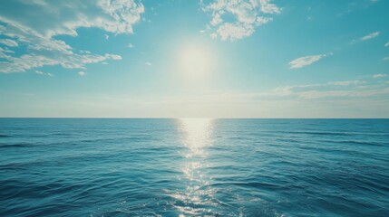 Fototapeta premium Tranquil ocean horizon with clear sky and radiant sunlight for meditation and relaxation themes