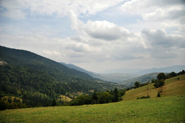Obraz premium landscape with beautiful mountain slopes and sky with clouds
