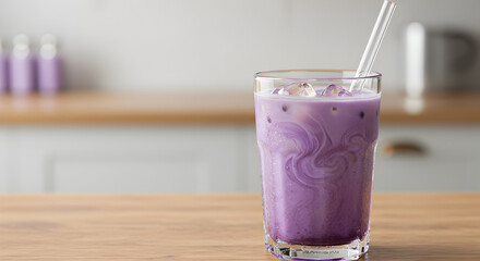 Iced Taro Latte With a Swirl in a Glass on a Wooden Table