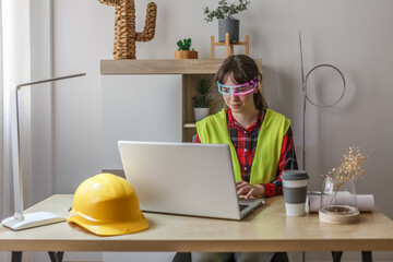 Woman wearing AI glasses working at a desk in a modern office