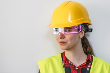 .Woman with AI glasses and safety equipment on a white background