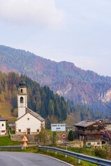 Fototapeta premium Sauris di Sotto road sign welcoming visitors to the charming Italian village in Friuli Venezia Giulia