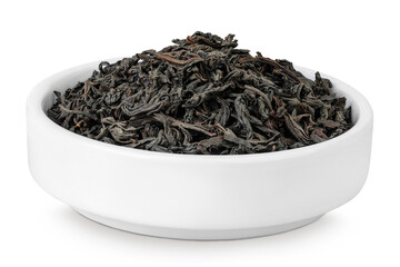 Dry black tea leaves in ceramic bowl isolated on white background