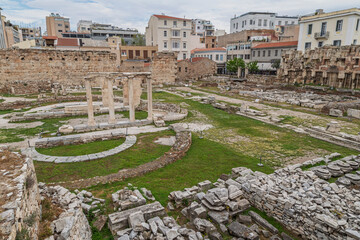 Old ancient ruins of the Hadrian's Library in downtown Athens, Greece on a cloudy day.