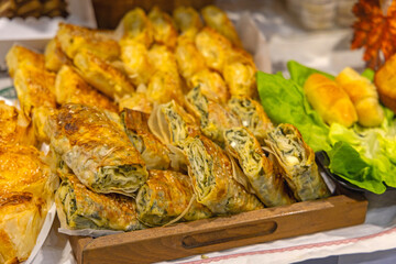 Traditional Food Spinach Pie Phyllo Roll Pastry at Wooden Tray