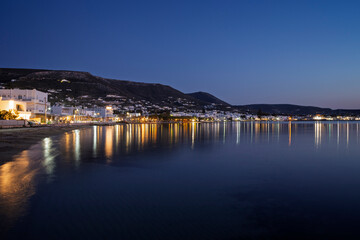 Scenic view of Paroikia (Parikia) town by the Aegean Sea on Paros island in Greece at dusk.