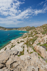 Rocky, lush and hilly landscape and the Aegean Sea at the Paros Park on Paros island in Greece...