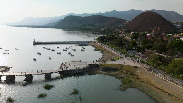 Aerial Drone View of Chapala Lakeside Boardwalk with Tourists Walking &mdash; Scenic Mexican Town and Waterfront