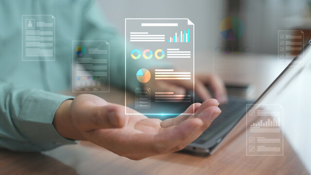 A futuristic data interface with graphs and charts floating above an open palm representing big data, business analytics, and digital management.