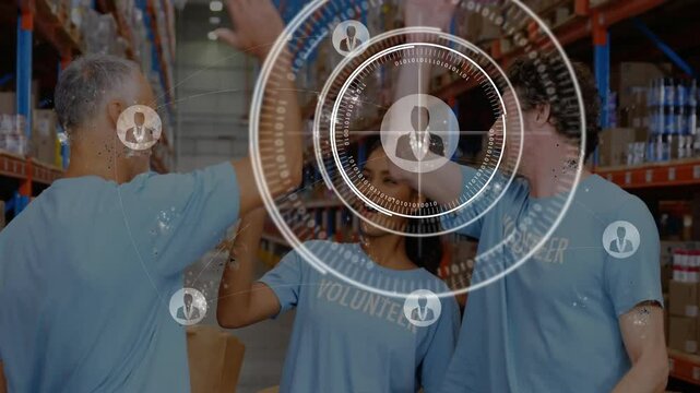 Volunteer team exchanging high-five in charity warehouse, displaying floating HUD with box charts