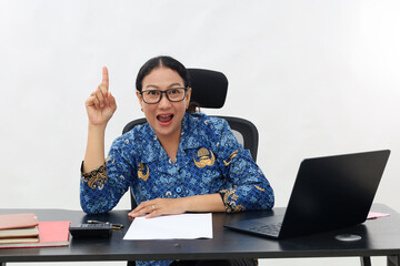 Young proactive smart successful employee civil servant woman sit work at office desk holding index...