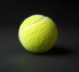 A tennis ball sits on a dark background.  Its vibrant yellow surface is textured with fuzz. A distinct white line encircles the ball