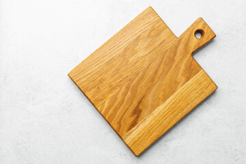 Wooden cutting board on light surface showcasing craftsmanship and design