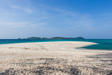 Beautiful white sand beach on the Andaman coast in Thailand, Koh Adang. Ko Lipe Island is visible on the horizon. Adang Island is part of Tarutao National Park, South Thailand.