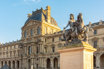 KIng Louis XIV statue in Napoleon courtyard of Louvre palace, Paris, France