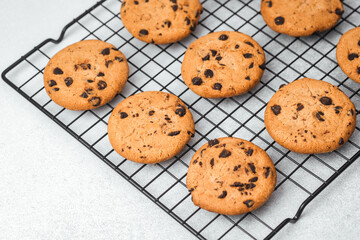 Freshly baked cookies cooling on a wire rack in a kitchen setting