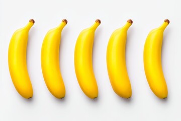 Five Fresh Yellow Bananas on White - Five ripe yellow bananas arranged in a row, symbolizing health, energy, vitality, tropical, and freshness