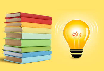 Idea and knowledge. Light bulb illustration and stack of books on yellow background