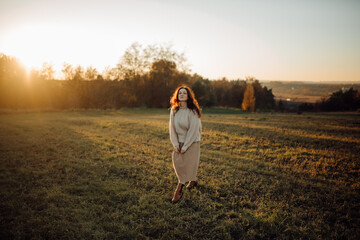 Woman enjoying a peaceful sunset in nature