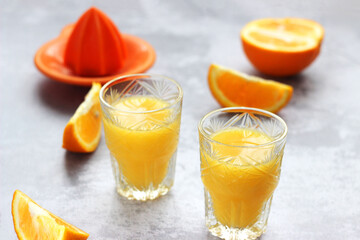 Freshly squeezed orange juice in glasses on the table