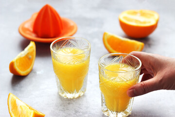 Freshly squeezed orange juice in glasses on the table