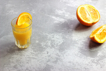Freshly squeezed orange juice in glasses on the table