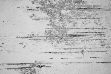 Distressed white wall with black and gray peeling texture in vertical abstract pattern