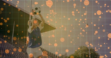 female athlete holding soccer ball overhead at stadium stands, showing finance data grid with coins - Powered by Adobe