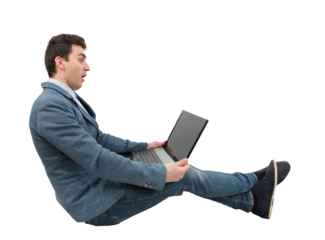 Full length portrait of a seated businessman looking amazed at a laptop monitor on his knees isolated on transparent background. Global network speed concept