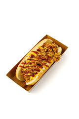 Hot dog with zigzag sauce on white background
