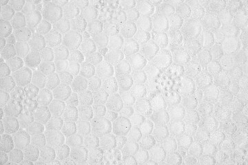 Texture of white patterned surface resembling natural elements and materials