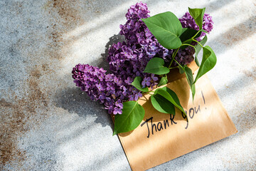 Lilac Bouquet with Thank You Note on Rustic Surface